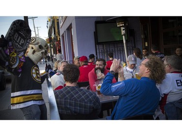 Luc Guertin who was dressed in a Bruins jersey walking along Elgin Street with a skeleton head on Sens Mile Sunday April 23, 2017.   Ashley Fraser/Postmedia