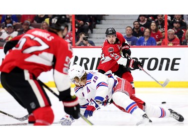 Marc Staal tries to block Jean-Gabriel Pageau's shot but it would go in for the game-winning goal in the second overtime period.