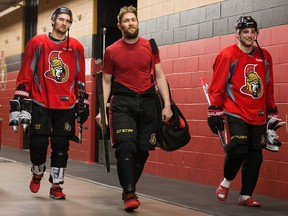 Mark Stone (from left) Zack Smith and Chris Wideman head to the dressing room at the Canadian Tire Centre after the Ottawa Senators practiced at the Bell Sensplex before the playoffs begin on Wednesday evening.