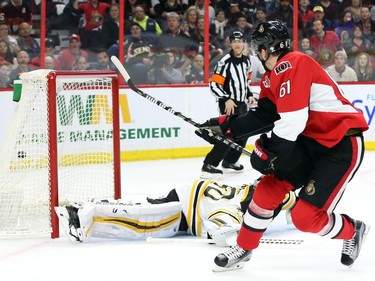 Mark Stone of the Ottawa Senators scores on Tuukka Rask of the Boston Bruins during the first period.