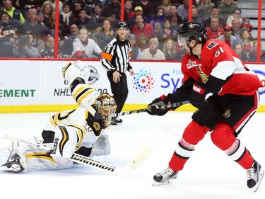 Mark Stone of the Ottawa Senators scores on Tuukka Rask of the Boston Bruins during the first period.