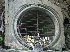 Massive sewage pipe flowing into the Ottawa River behind the Supreme Court of Canada.