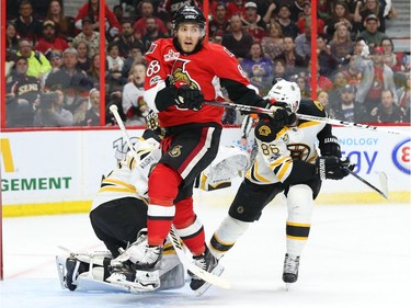 Mike Hoffman of the Ottawa Senators  jumps in front of Tuukka Rask of the Boston Bruins during the third period.