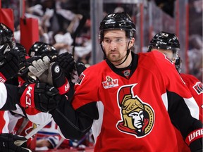 The Senators' Mark Stone celebrates his third-period goal against the New York Rangers at the bench in Game 2.