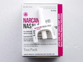A nasal spray containing naloxone, taken from an naloxone emergency kit, is shown at a pharmacy.