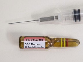 A vial containing naloxone, taken from an naloxone emergency kit, is shown at a pharmacy in Toronto, on April 11 , 2017.