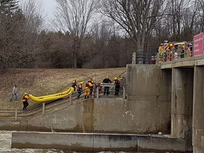 Ottawa Fire Services water rescue officers work to rescue an otter trapped in turbulence on Saturday, April 15, 2017.