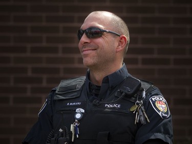 Ottawa Police Community Police Officer Cst. Brad Burleau at the community safety march on Jasmine Crescent Sunday April 9, 2017.   Ashley Fraser/Postmedia