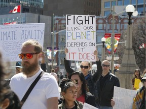 Ottawa residents concerned about climate, jobs and justice take part in a march to the United States embassy in Ottawa on Saturday, April 29, 2017.   (Patrick Doyle)  ORG XMIT: 0430 climate 11
