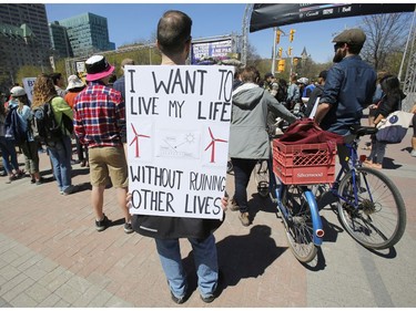 Ottawa residents concerned about climate, jobs and justice take part in a march to the United States embassy in Ottawa on Saturday, April 29, 2017.   (Patrick Doyle)   ORG XMIT: 0430 climate 02