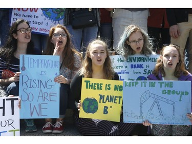 Ottawa residents concerned about climate, jobs and justice take part in a march to the United States embassy in Ottawa on Saturday, April 29, 2017.   (Patrick Doyle)  ORG XMIT: 0430 climate 09