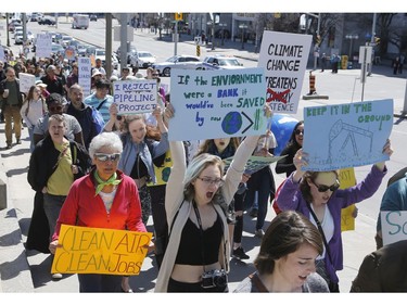 Ottawa residents concerned about climate, jobs and justice take part in a march to the United States embassy in Ottawa on Saturday, April 29, 2017.   (Patrick Doyle)  ORG XMIT: 0430 climate 08