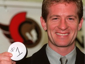 Ottawa Senator Goaltender Damian Rhodes holds the #1 puck signifying his first goal as Senator which happend during the game against New Jersey Saturday January 2, 1999.  Taken January 3, 1999.