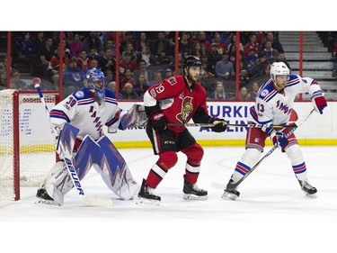 Ottawa Senators #19 Derick Brassard between New York Rangers goalie Henrik Lundqvist and #43 Steven Kampfer during the first period of play at Canadian Tire Centre Saturday April 8, 2017.