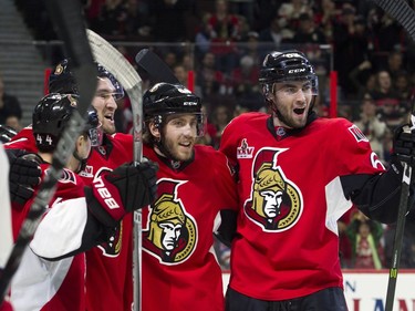 The Ottawa Senators' Jean-Gabriel Pageau celebrates his goal with teammates.