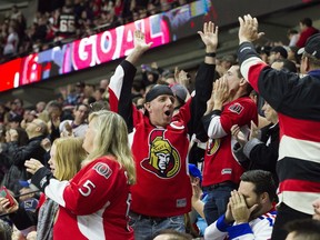 Ottawa Senators fans react after a goal in the second period against the New York Rangers at the Canadian Tire Centre on Saturday, April 8, 2017.