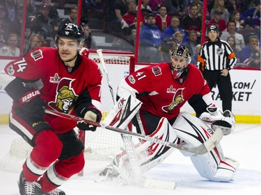 Senators defenceman Mark Borowiecki and goalie Craig Anderson keep an eye on the puck during Saturday's game against the Rangers.