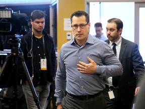 Ottawa Senators head coach Guy Boucher walks in to talk to the media on Thursday following the team's loss to Boston in Game 1 on Wednesday.