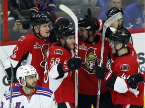 Mark Stone, third from left, joins Senators teammate Dion Phaneuf, Mike Hoffman (68) and Jean-Gabriel Pageau (44) in celebrating Hoffman's second-period goal against the Rangers on Saturday.