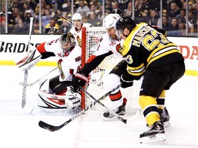 Marc Methot of the Ottawa Senators and goalie Craig Anderson defend against Brad Marchand of the Boston Bruins during the first period of Game 4 on Wednesday, April 19, 2017.