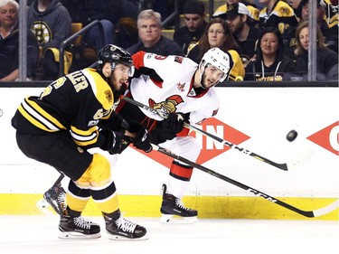 Derick Brassard of the Ottawa Senators takes a shot past Colin Miller.