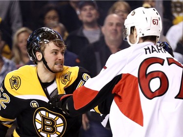 Sean Kuraly #52 of the Boston Bruins fights Ben Harpur #67 of the Ottawa Senators during the first period of Game Six of the Eastern Conference First Round against the Ottawa Senators during the 2017 NHL Stanley Cup Playoffs at TD Garden on April 23, 2017 in Boston, Massachusetts.