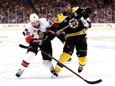 Clarke MacArthur #16 of the Ottawa Senators and Patrice Bergeron #37 of the Boston Bruins battle for control of the puck during the second period of Game Six of the Eastern Conference First Round during the 2017 NHL Stanley Cup Playoffs at TD Garden on April 23, 2017 in Boston, Massachusetts.
