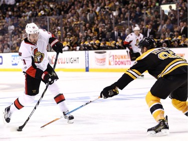 Mark Stone #61 of the Ottawa Senators takes a shot against Kevan Miller #86 of the Boston Bruins during the second period of Game Six of the Eastern Conference First Round during the 2017 NHL Stanley Cup Playoffs at TD Garden on April 23, 2017 in Boston, Massachusetts.