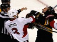 Marc Methot of the Ottawa Senators punches Tim Schaller of the Boston Bruins in the third period in Game Three.