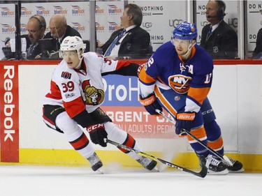 NEW YORK, NY - APRIL 09: Andreas Englund #39 of the Ottawa Senators skates against Josh Bailey #12 of the New York Islanders during the first period at the Barclays Center on April 9, 2017 in the Brooklyn borough of New York City.