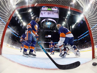 NEW YORK, NY - APRIL 09: Calvin de Haan #44 and Thomas Greiss #1 of the New York Islanders look back at the goal scored by Bobby Ryan #9 of the Ottawa Senators during the second period at the Barclays Center on April 9, 2017 in the Brooklyn borough of New York City.