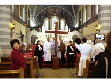 Parishioners from St. Anthony's church performed the Way of the Cross during Good Friday in Little Italy on April 14, 2017.