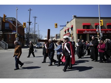 Parishioners from St. Anthony's church performed the Way of the Cross during Good Friday in Little Italy on April 14, 2017.