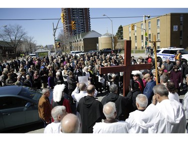 Parishioners from St. Anthony's church performed the Way of the Cross during Good Friday in Little Italy on April 14, 2017.