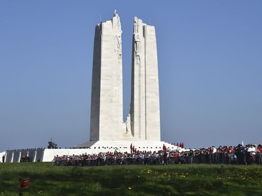 People attend attend the commemorations of the 100th anniversary of the Battle of Vimy Ridge, a World War I battle which was a costly victory for Canada but one that helped shape the former British colony's national identity, at the WWI Canadian National Vimy Memorial in Vimy, near Arras, northern France, Sunday, April 9, 2017.