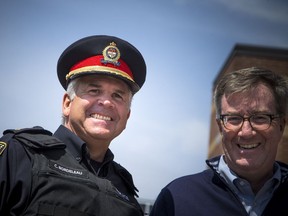 Police Chief Charles Bordeleau and Mayor Jim Watson before the community safety march kicked off on Jasmine Crescent Sunday April 9, 2017.   Ashley Fraser/Postmedia