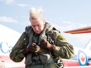 Postmedia photographer Ashley Fraser gets prepared for her flight with Snowbird 11 Coordinator: Captain Paul Faulkner Saturday April 29, 2017. The Snowbirds are in the Ottawa Gatineau region for the Aero150 air show being held at the Gatineau Ottawa Executive Airport.  Patrick Cardinal/Snowbirds