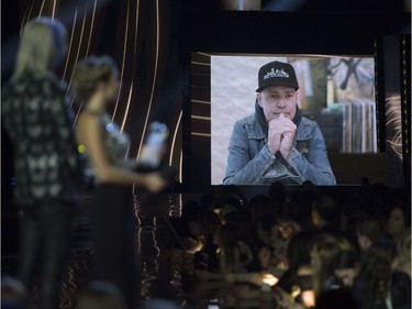 Presenters watch as a video of Gord Downie is played after he won the Songwriter of the Year at the Juno awards show Sunday April 2, 2017 in Ottawa.