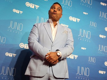 Russell Peters poses as musical talent take to the red carpet at the Juno Awards held on Sunday at the Canadian Tire Centre.