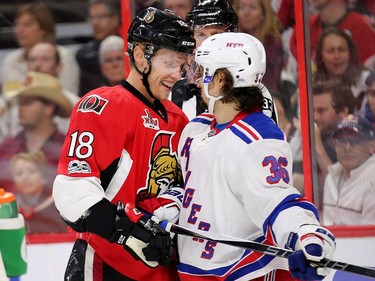 Ryan Dzingel and Mats Zuccarello stare each other down in the first period.