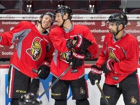 Ryan Dzingel (L) and Kyle Turris share a laugh as Clarke MacArthur skates past as the Ottawa Senators practice at the Canadian Tire Centre in preparation for Round 2 against the New York Rangers in the NHL playoffs.