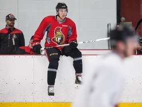 Ryan Dzingel waits to jump on the ice as the Senators practise at the Bell Sensplex on Friday.   Wayne Cuddington/Postmedia