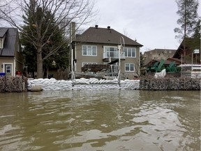 Sand bags protect this property on the Ottawa River in Aylmer Blair Crawford/Postmedia