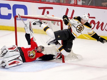 Sean Kuraly flies over goalie Craig Anderson. The Bruins believed a goal was scored on the play but it was ruled "no goal" in the first overtime period.