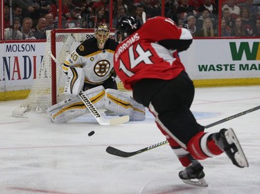 The Ottawa Senators' Alex Burrows shoots on Boston goalie Tuukka Rask in the first period.