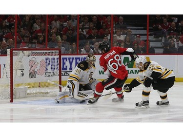 The Ottawa Senators' Mike Hoffman shoots on Boston goalie Tuukka Rask in the first period.