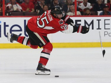 Erik Karlsson breaks a stick during second-period action Saturday.