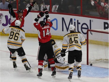 The Ottawa Senators celebrate after Dion Phaneuf's overtime goal.