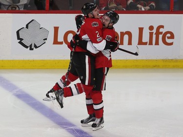 The Ottawa Senators' Dion Phaneuf and Mark Stone begin the overtime celebration.