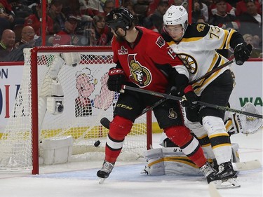 Zack Smith watches Chris Wideman's third-period shot enter the Bruins' net.